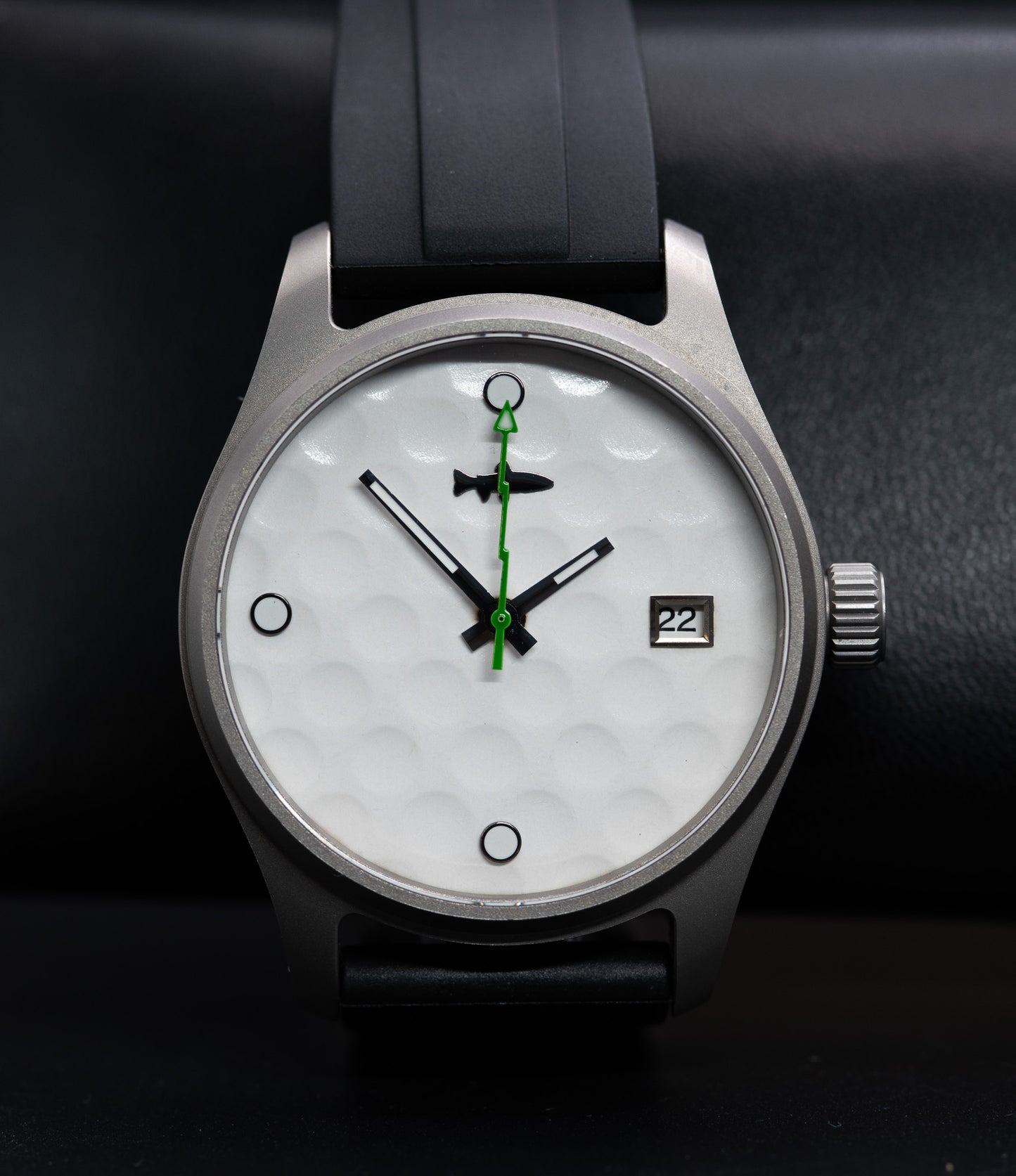 Custom made golf ball watch in a Titanium case a black rubber strap with stainless steel clasp